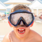 Closeup,Portrait,Of,A,Happy,Laughing,Boy,With,Diving,Mask