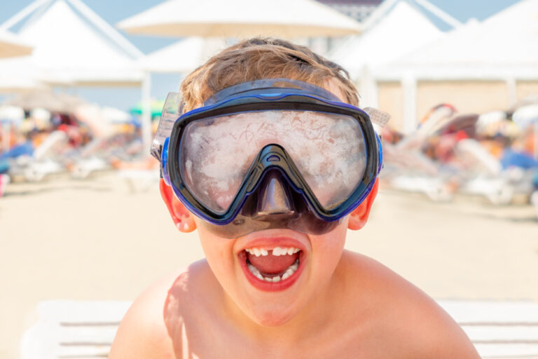 Closeup,Portrait,Of,A,Happy,Laughing,Boy,With,Diving,Mask